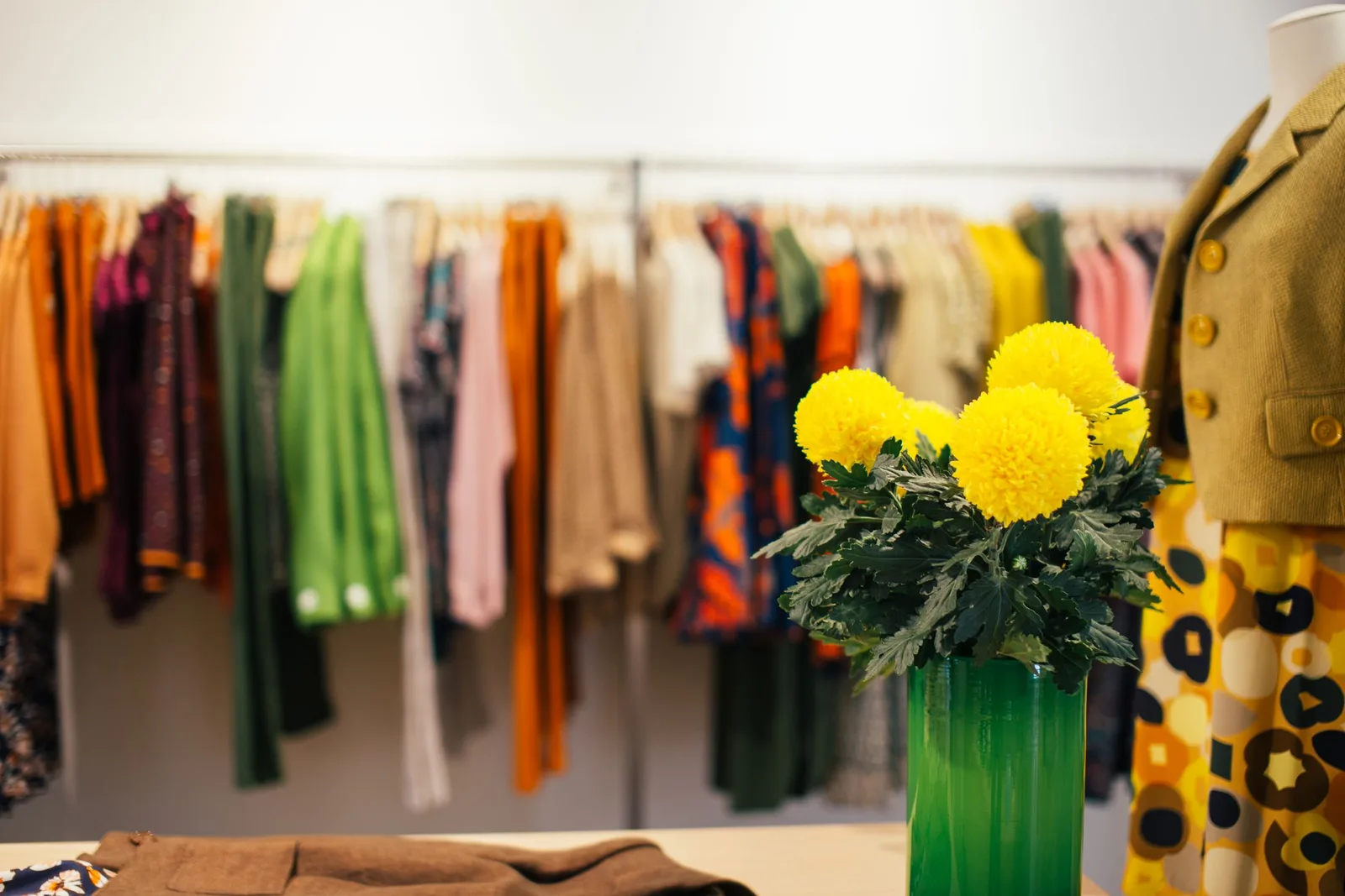 Boutique-এর rack-এ সাজানো বিভিন্ন colour ও style-এর পোশাক