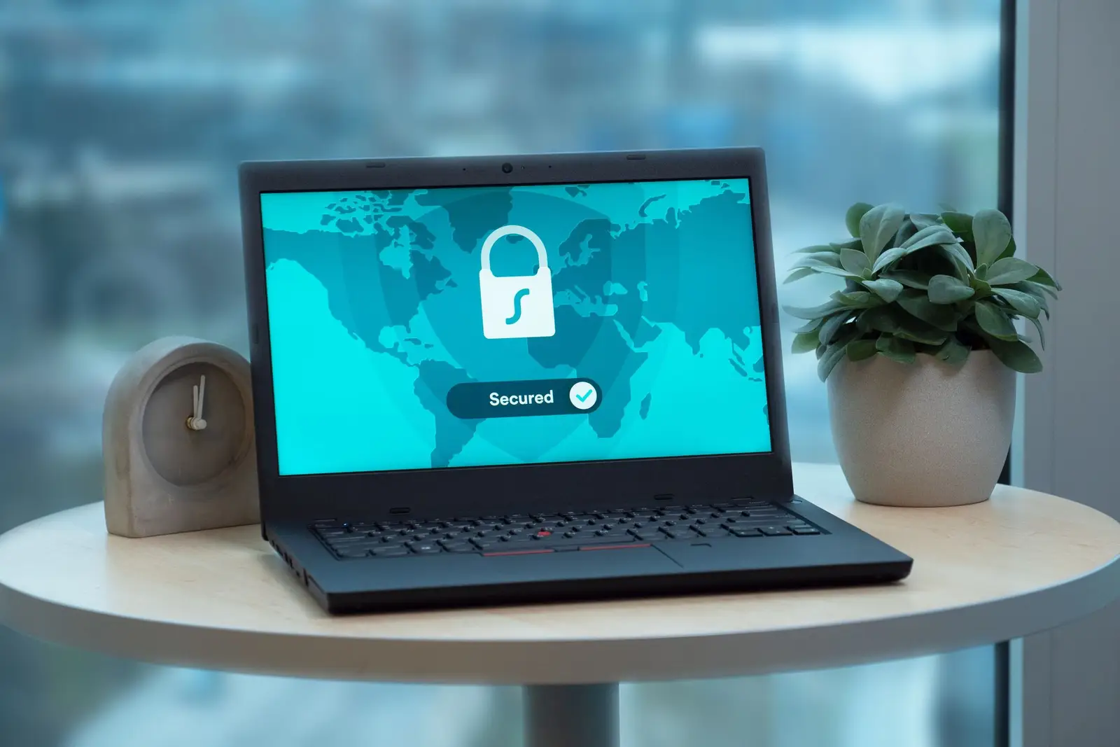 Table-এর উপর laptop screen-এ security lock icon দেখিয়ে SSL certificate renewal বোঝানো হয়েছে